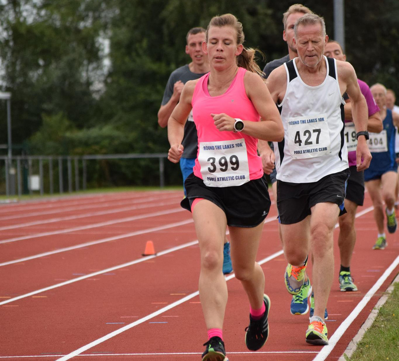 Female runner at 3000m track event at Ashdown, Poole
