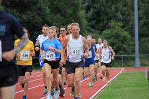 Group of runners at Poole AC running track