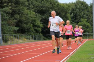 Man running on running track at Poole AC